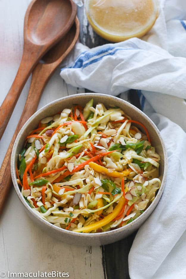 Caribbean Coleslaw in a Gray Bowl with Two Ladles in the Background