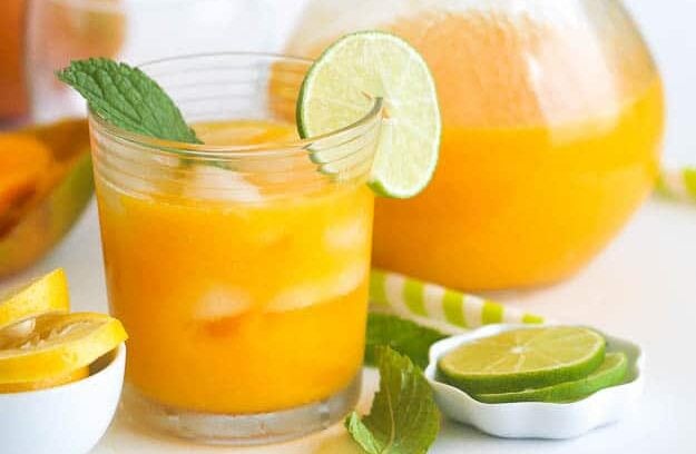 A pitcher of insanely delicious mango lemonade for a refreshing treat