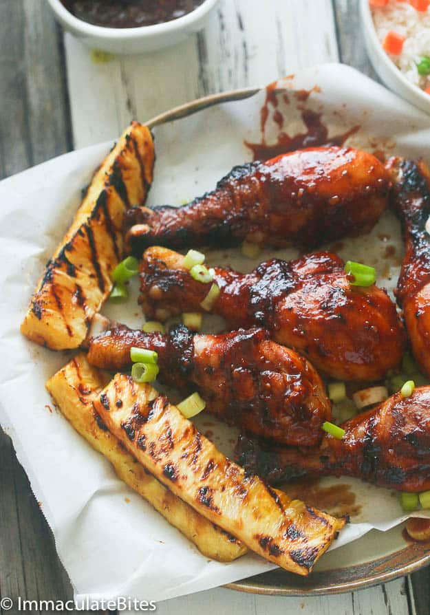 A Plate of Saucy Huli Huli Chicken with Grilled Pineapple Slices