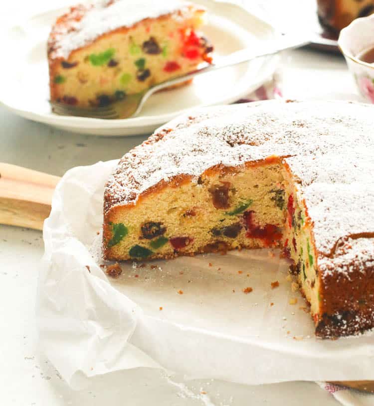 Fruit Cake served with tea in the background