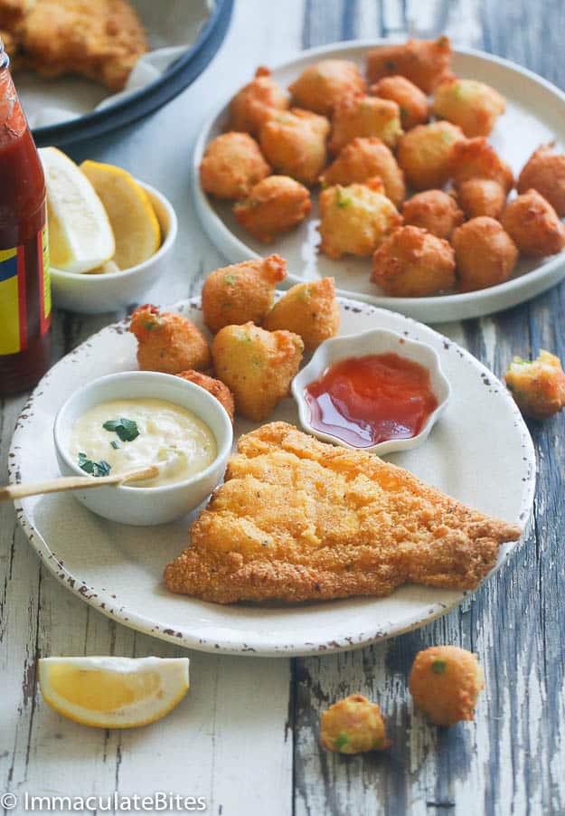 Fish with hush puppies, ketchup, and tartar sauce for pure soul food