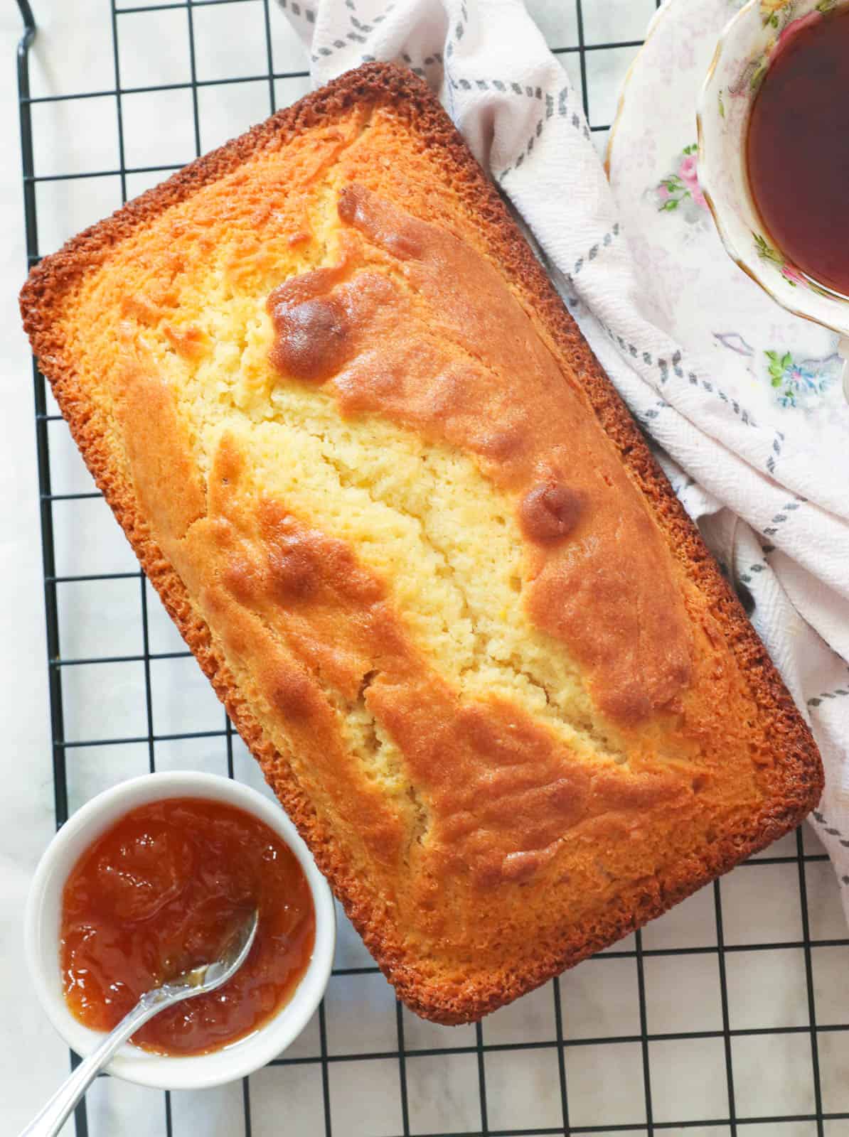 Whole French Yogurt Cake with marmalade on the cooling rack