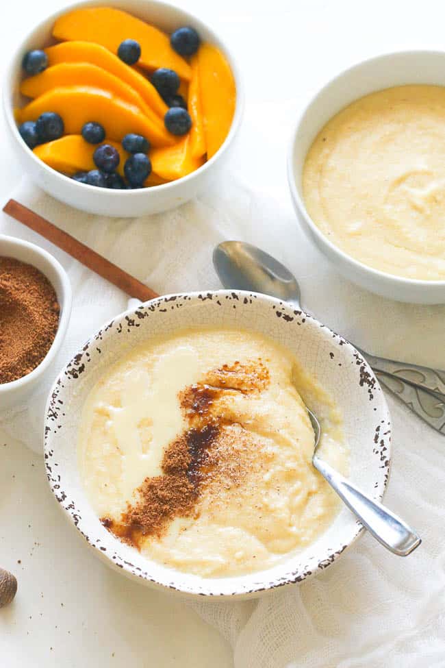 Enjoying pure comfort food with Jamaican cornmeal porridge, mangos and blueberries