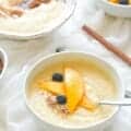 Jamaican cornmeal porridge with mango slices and blueberries