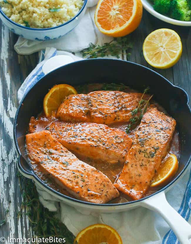 A pan of Orange Honey Glazed Salmon topped with thyme