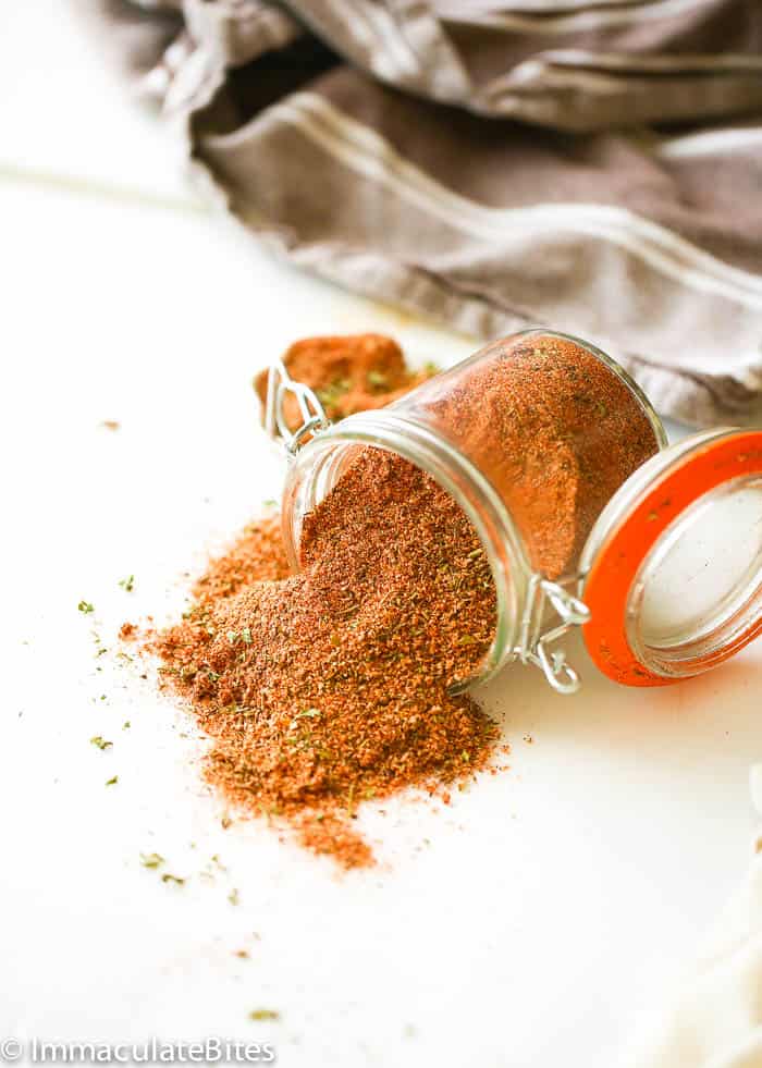 Creole Seasoning spilling beautifully from a jar