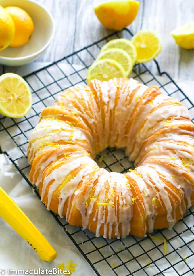Lemon sour cream pound cake glazed and decorated with fresh lemon zest