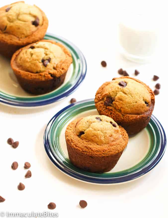 Chocolate chip muffins on two green and beige plates