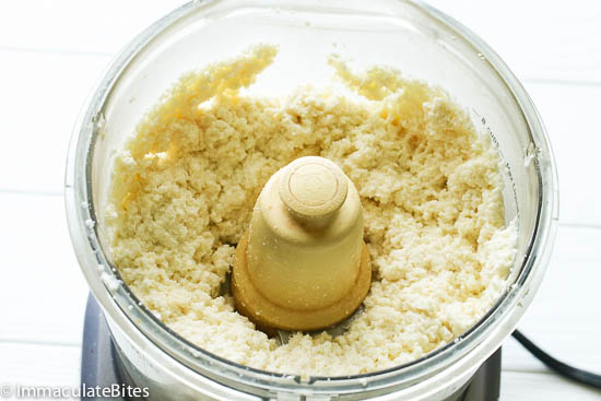 Grate the yuca in the food processor