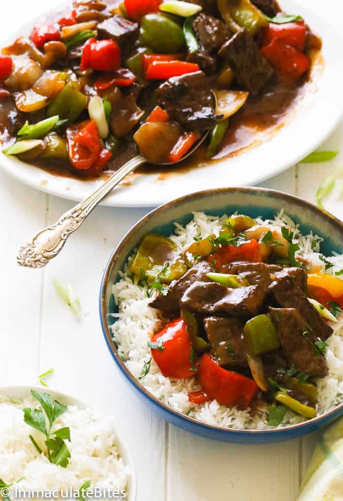 Serving up insanely delicious pepper steak over rice