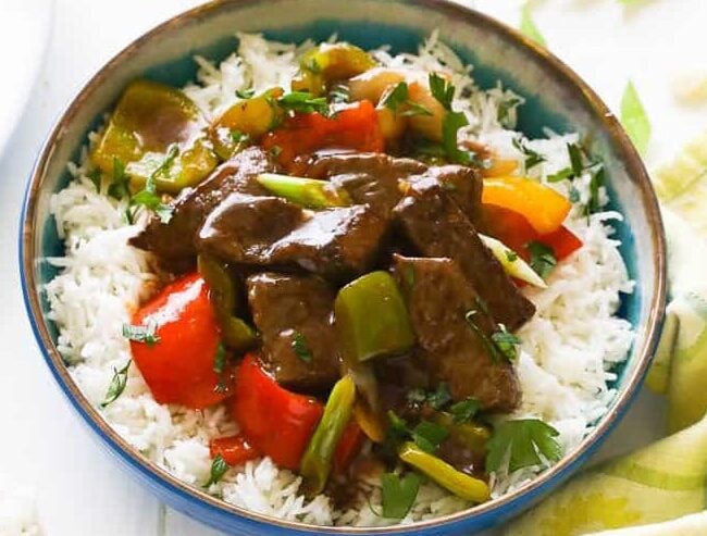 Tasty, savory pepper steak over rice for a quick and easy weeknight dinner