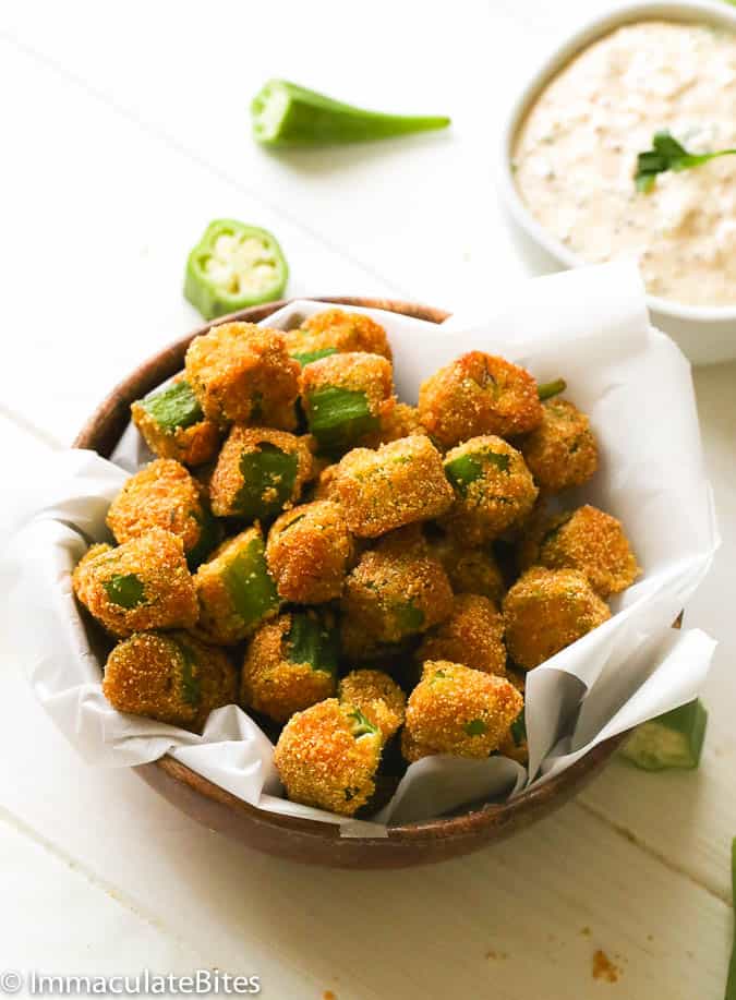 Crispy fried okra in a basket with remoulade on the side