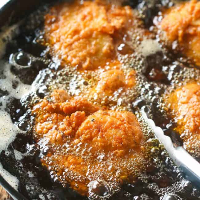 Southern Fried Chicken frying in a Cast Iron