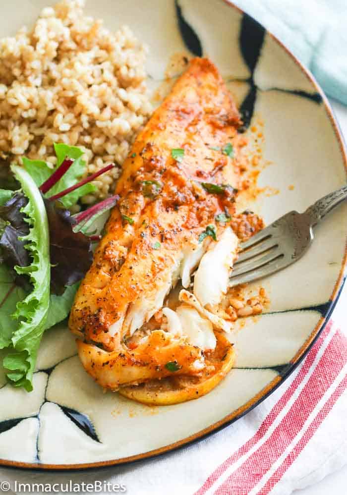 Forking into perfectly flaky baked tilapia fresh from the oven