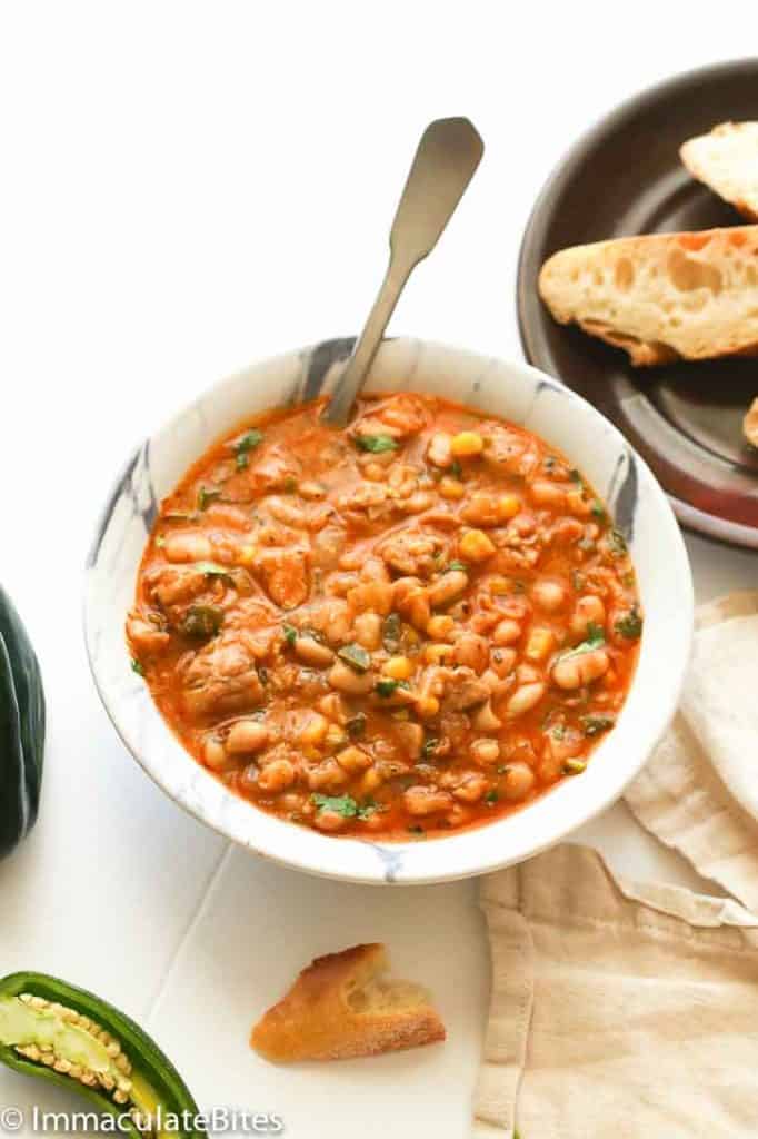 Serving up a soul-satisfying bowl of white bean chicken chili with crusty bread