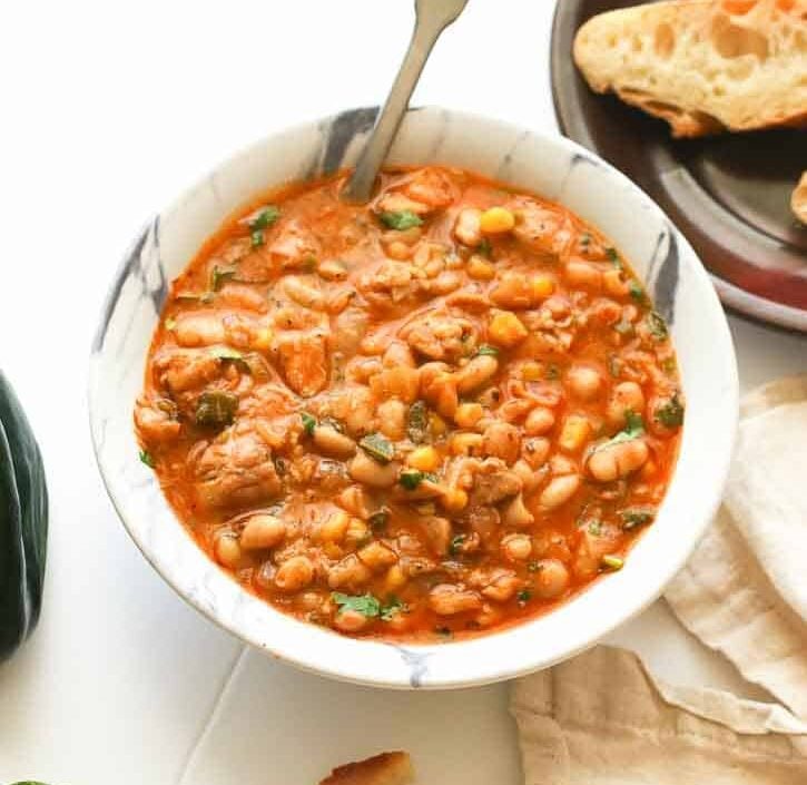 Serving up a soul-satisfying bowl of white bean chicken chili with crusty bread