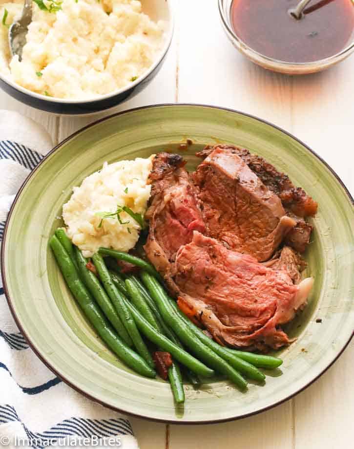 Insanely delicious prime rib roast with mashed potatoes and green beans