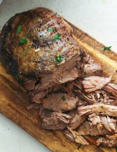 Slow Cooker Lamb Leg on a Chopping Board