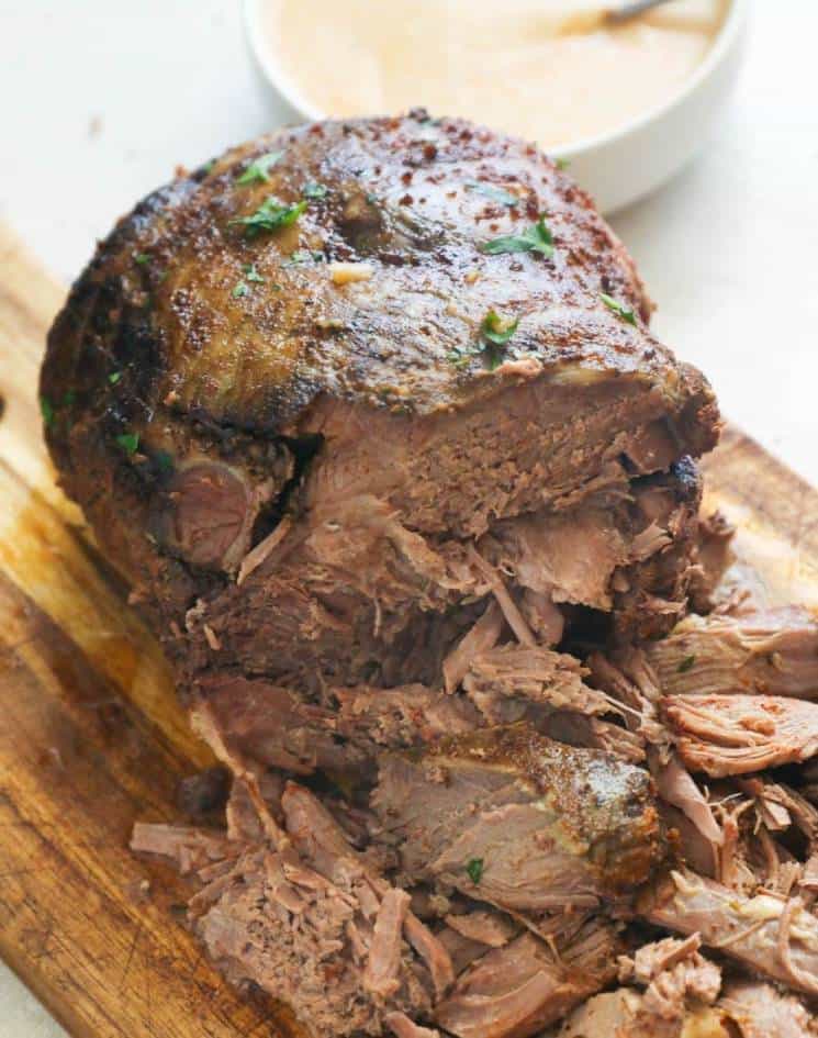 Slow Cooker Lamb Leg on a Chopping Board