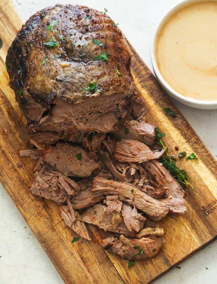 Slow Cooker Lamb Leg on a Chopping Board