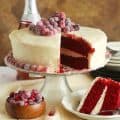 Whole red velvet cake sliced for a soul food dessert