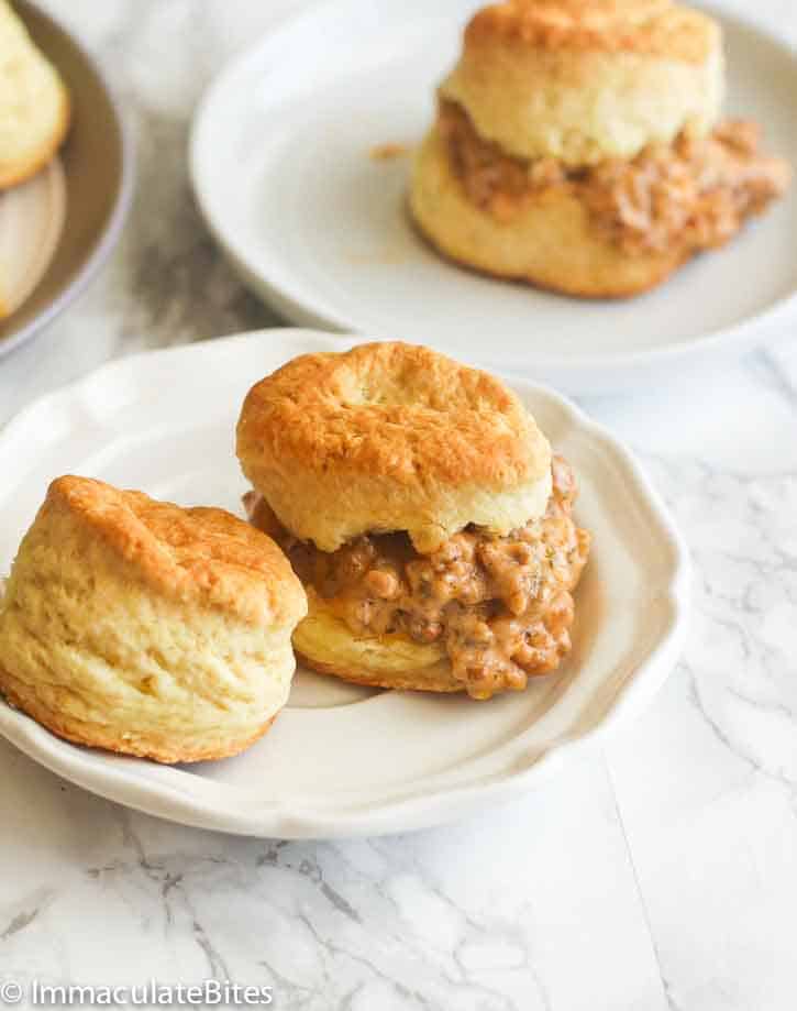 Biscuits and sausage gravy made into a sandwich for an easy grab and go breakfast