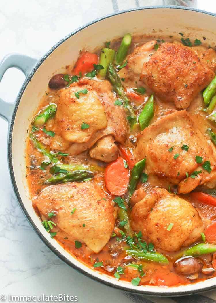 A Pan of Chicken Fricassee with Asparagus and Carrots