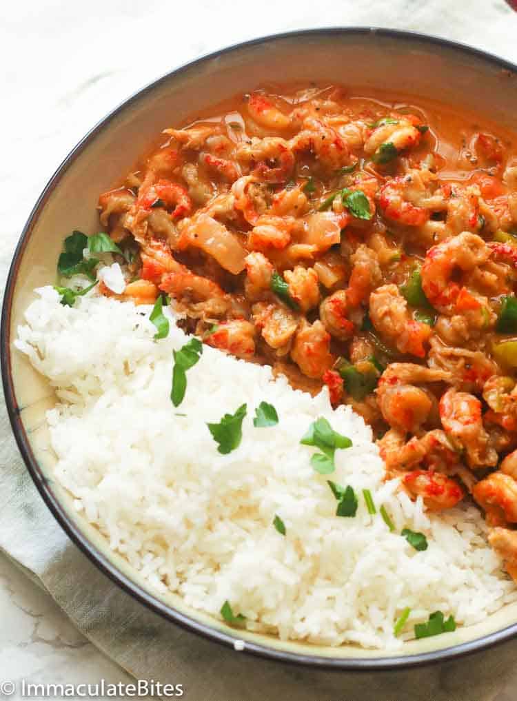 Immaculatebites Crawfish Etouffee served with rice and garnished with parsley