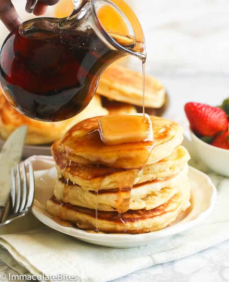 Pancakes stacked with a drizzle of maple syrup