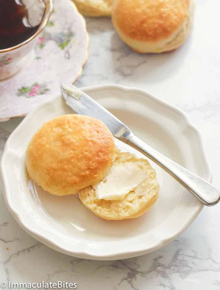 Slathering a heavenly angel biscuit with butter