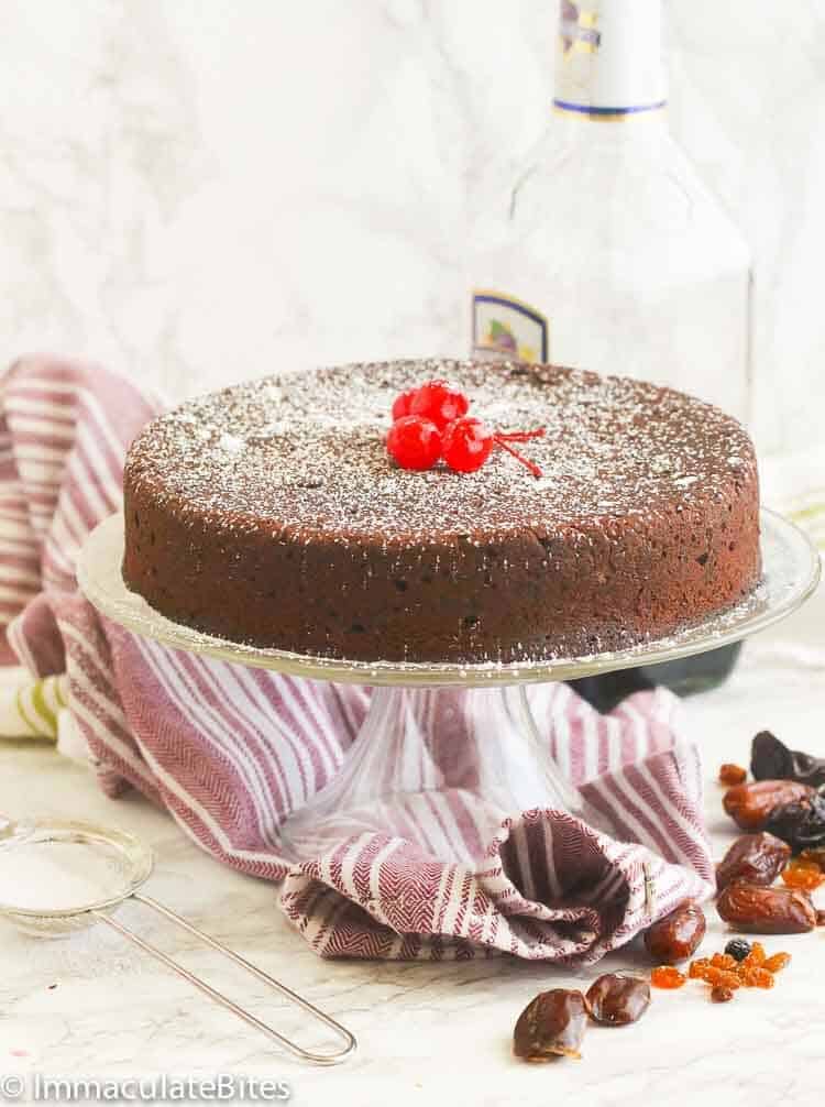 Boozy Thanksgiving desserts featuring Caribbean Black Cake topped with Cherries