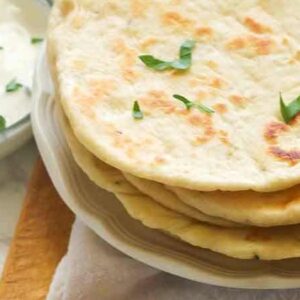 Insanely comforting flatbread ready to enjoy with a yogurt sauce