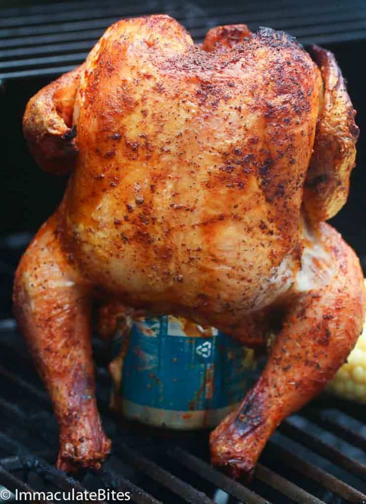 A beer can chicken proudly standing upright on the grill for an insanely delicious centerpiece.