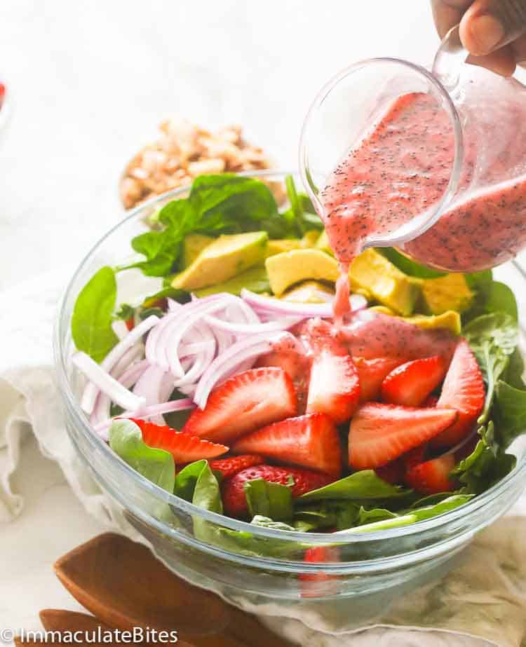 Strawberry Spinach Salad poured over with Strawberry dressing 
