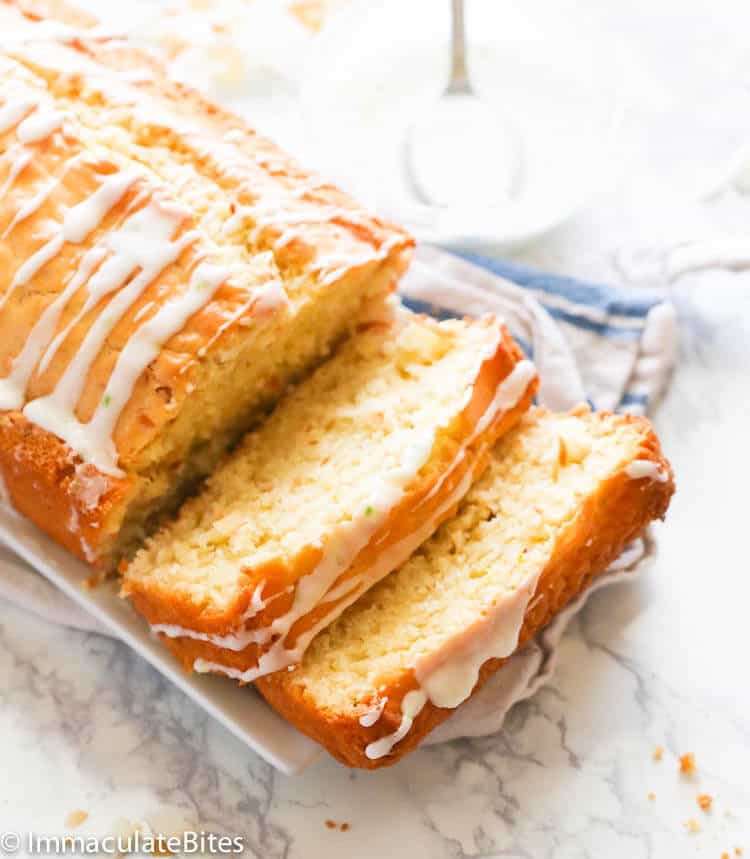 Freshly baked coconut bread with glaze drizzled over the top