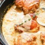 Creamy and delicious smothered chicken in a pan ready to serve up