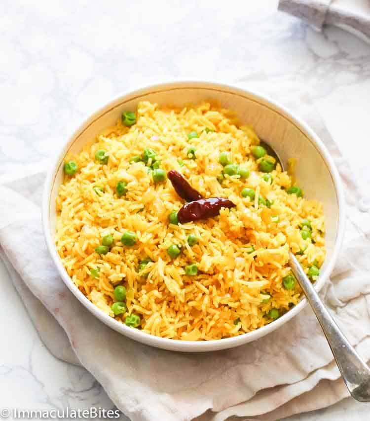 Bowl of Indian yellow rice with cayenne pepper