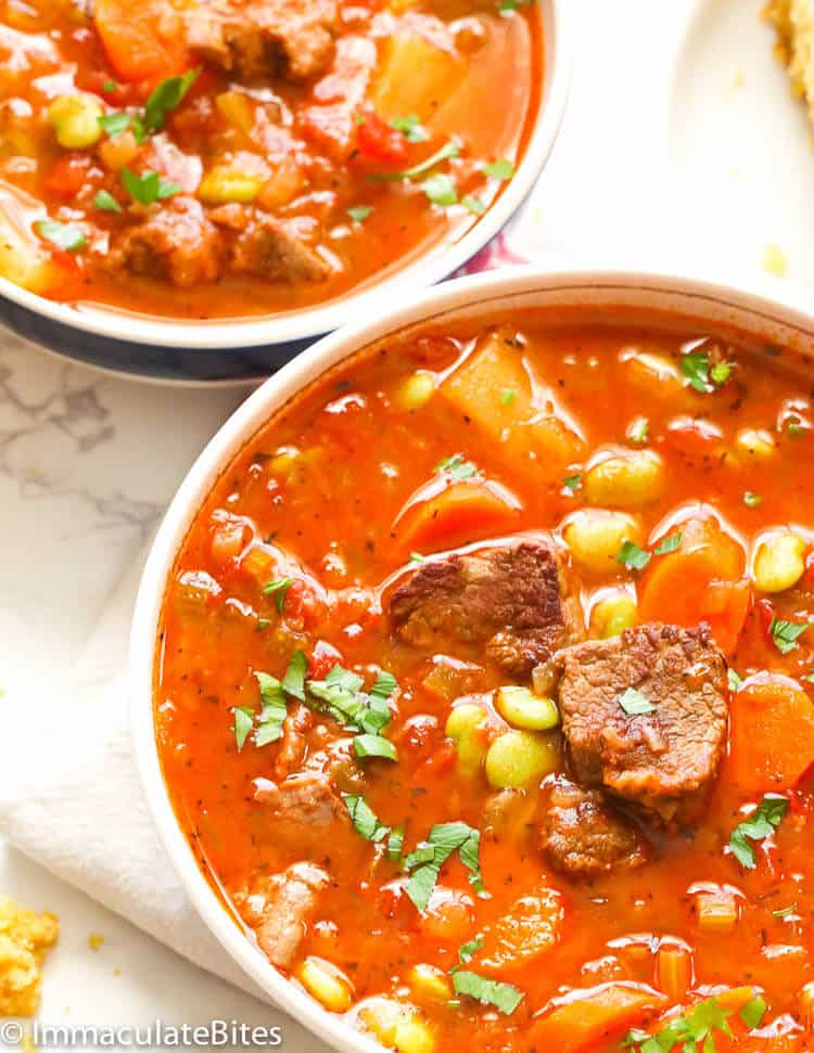 I munch on a bowl of beef-filled vegetable soup.