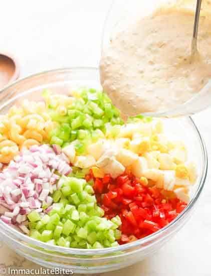 Macaroni Salad Ingredients covered in a mayo-based dressing