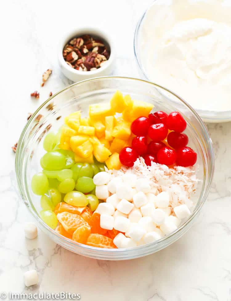 Ambrosia Salad Ingredients in a Clear Bowl