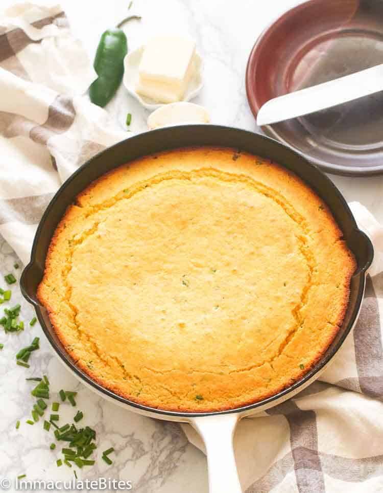 Skillet Cornbread with buttermilk still in the pan waiting to be served