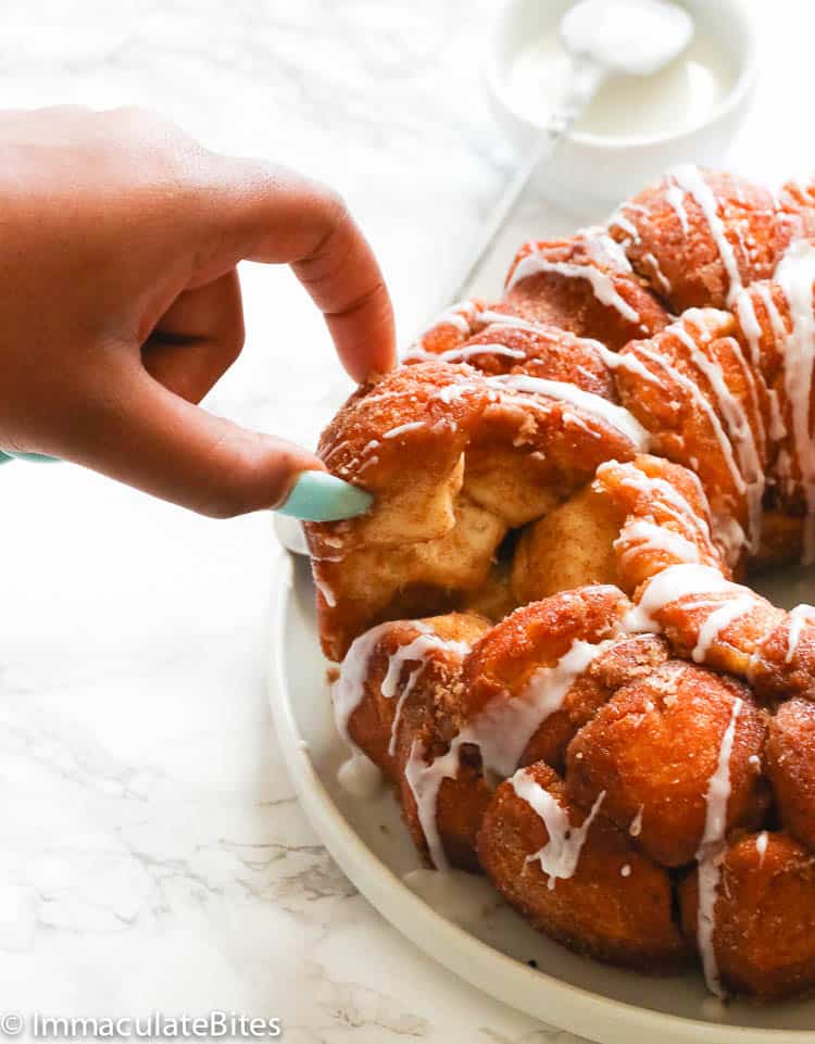 Taking a chunk of monkey bread for a satisfying breakfast.