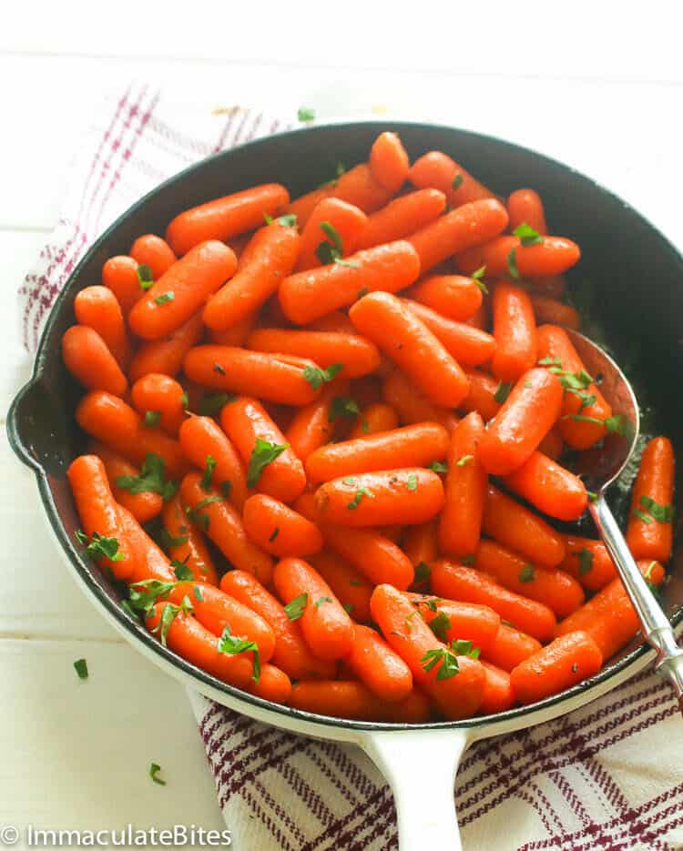 Honey Glazed Carrots in a Pan Garnished with Parsley