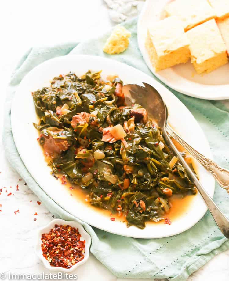 Collard greens served with cornbread and pepper flakes