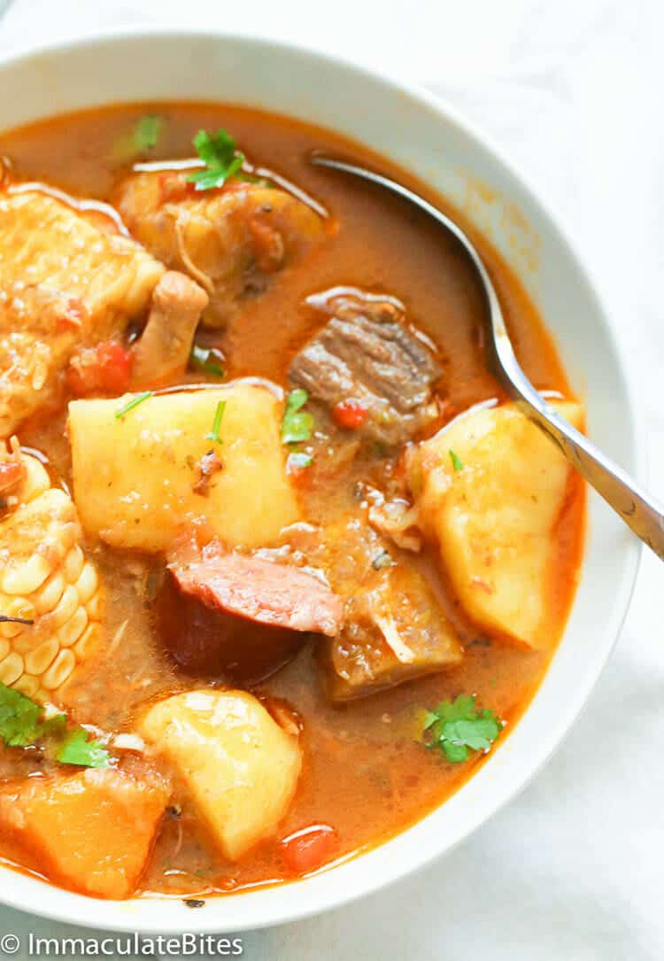Puerto Rican Sancocho in a white bowl ready to satisfy your hunger