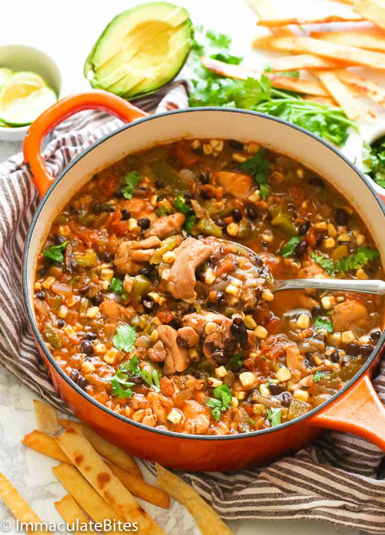 Chicken Tortilla Soup Being Spooned Out of the Pan