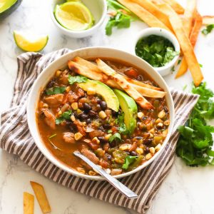 Chicken Tortillas Soup topped with avocado slice