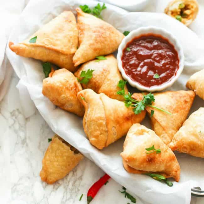 Samosas with dipping sauce for a decadent appetizer