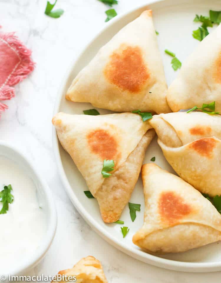A plateful of freshly baked samosas for a healthier treat
