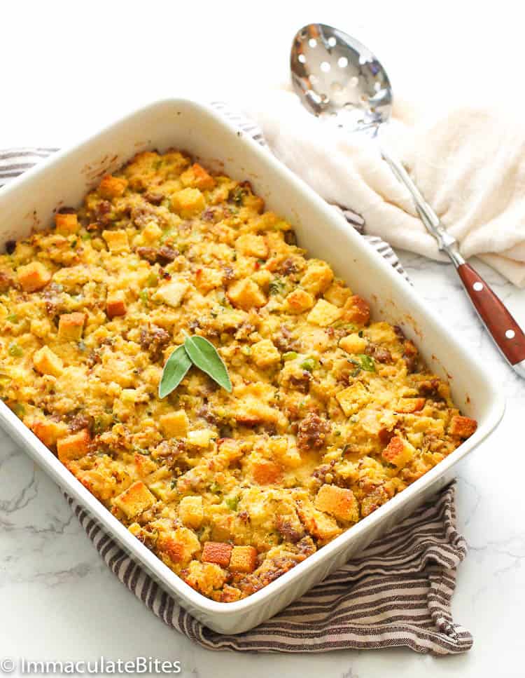 Cornbread Dressing in a Casserole with a Ladle on the Side